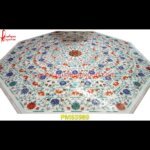 Red And Blue Flower Art Pichkari On Marble Table Top