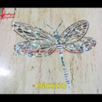 Insect Pichkari On White Marble Table Top